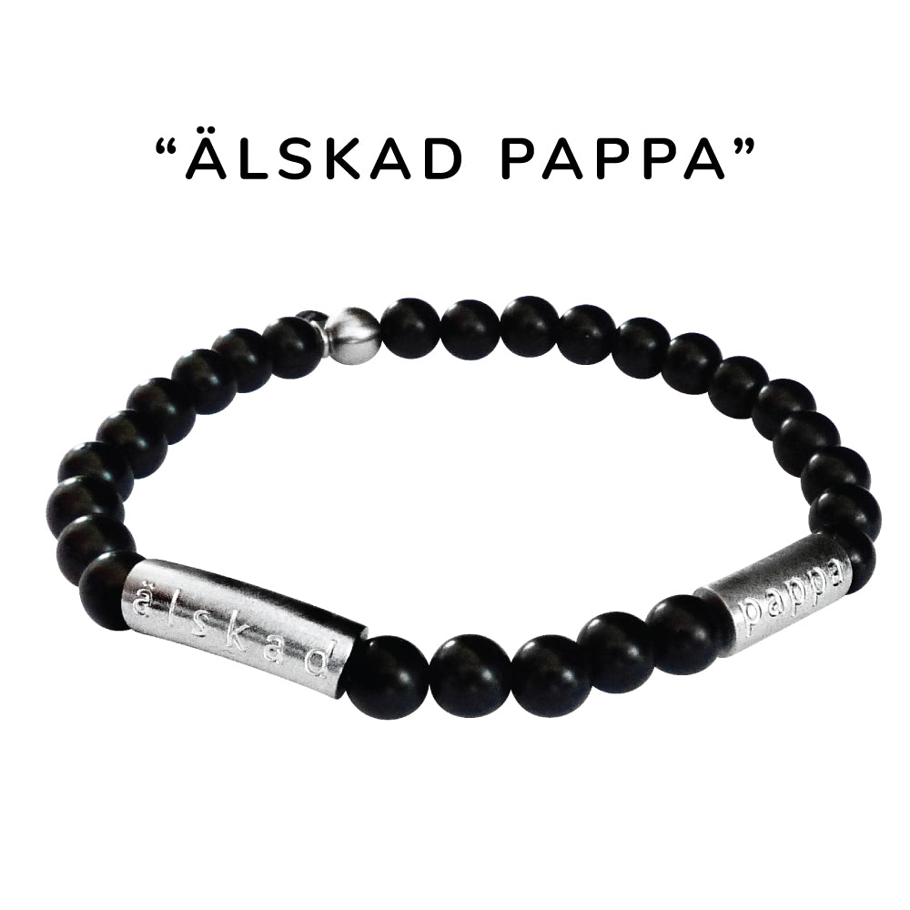 Snyggt elastiskt armband i matt svart halvädelstenen onyx och borstad stål