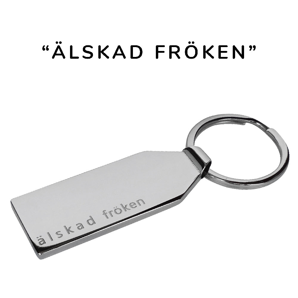 Stilren personlig nyckelring i polerat rostfritt stål med färdig-graverad text